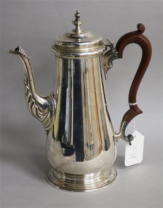 A 1970s Georgian design silver coffee pot, C.J Vander Ltd, London, 1973, gross 29.5 oz.